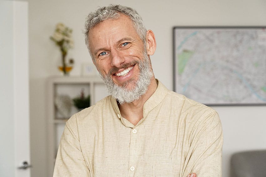 mature man smiling at home